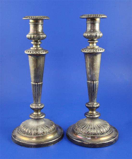 A pair George III silver candlesticks by John Roberts & Co, weighted.